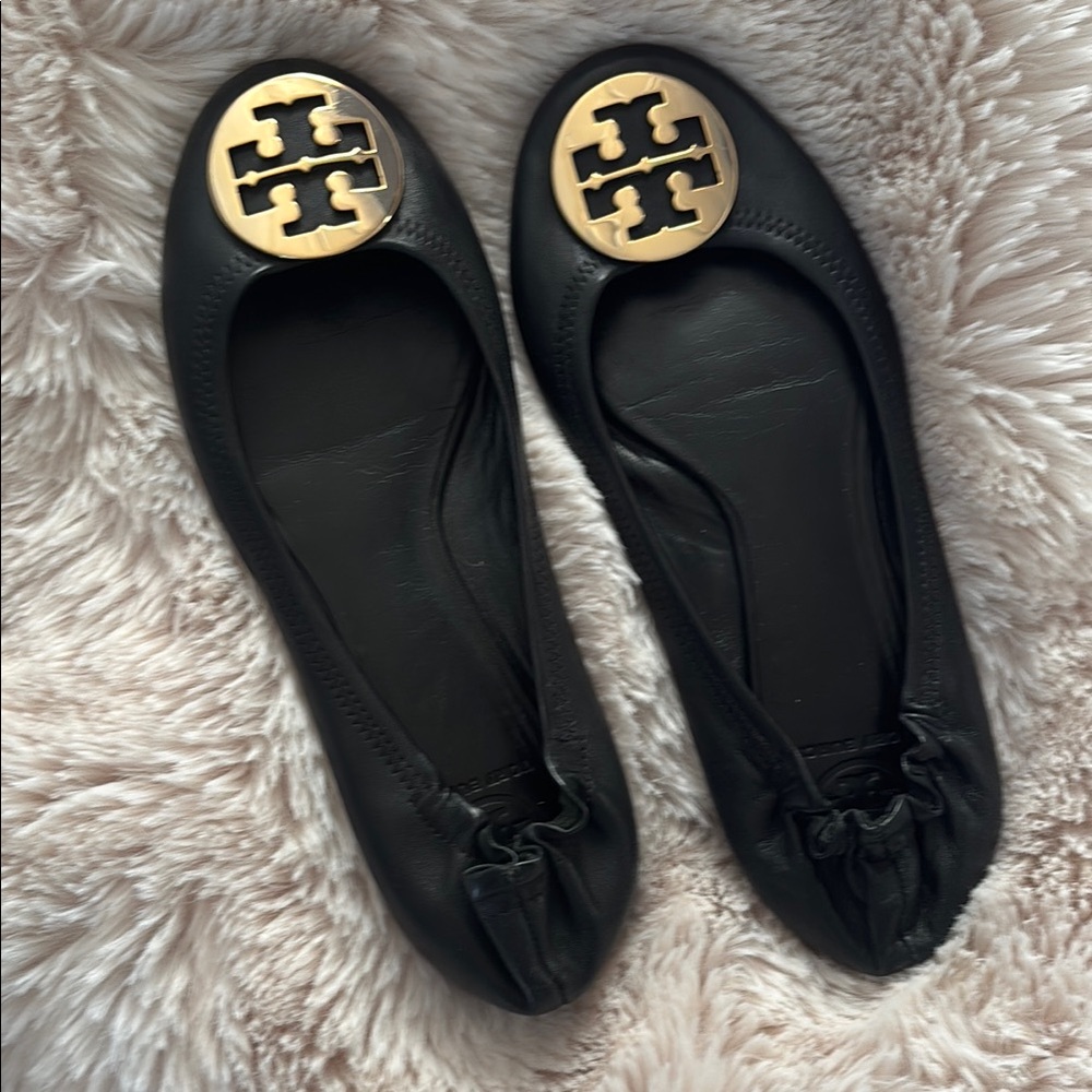 Tory Burch Black and Gold Reva Flats with Signature Emblem